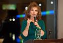 Renata Byler accepts the Family Hall of Fame Award for Denver Roller Family